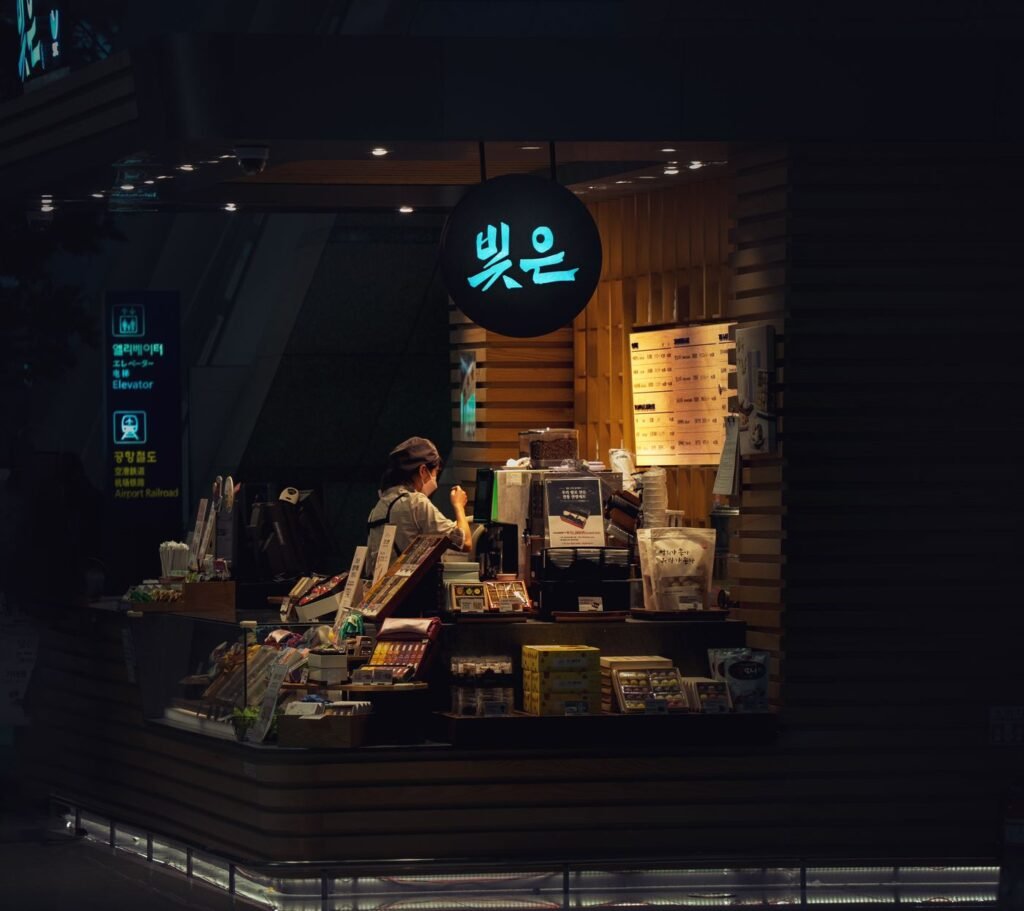 A lit coffee counter at night