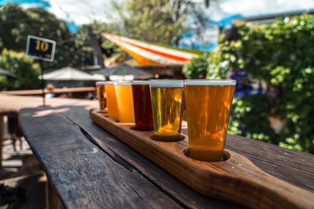 Two glasses of beer on an outdoor table