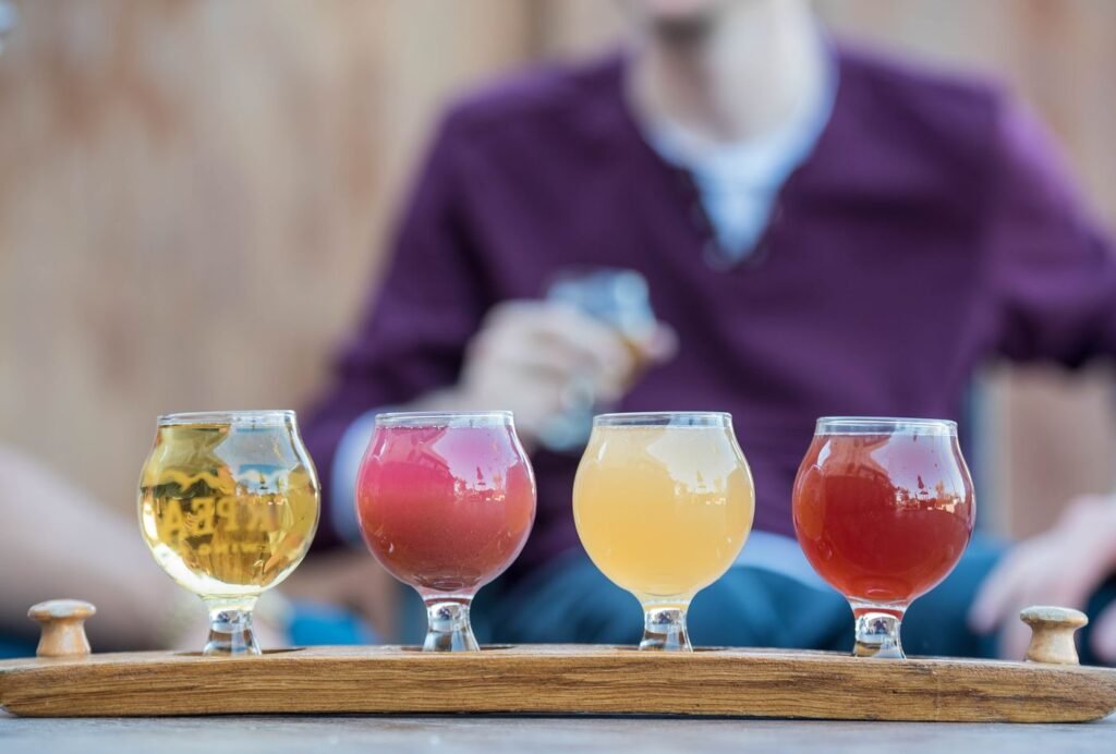 A flight of ciders in tasting glasses