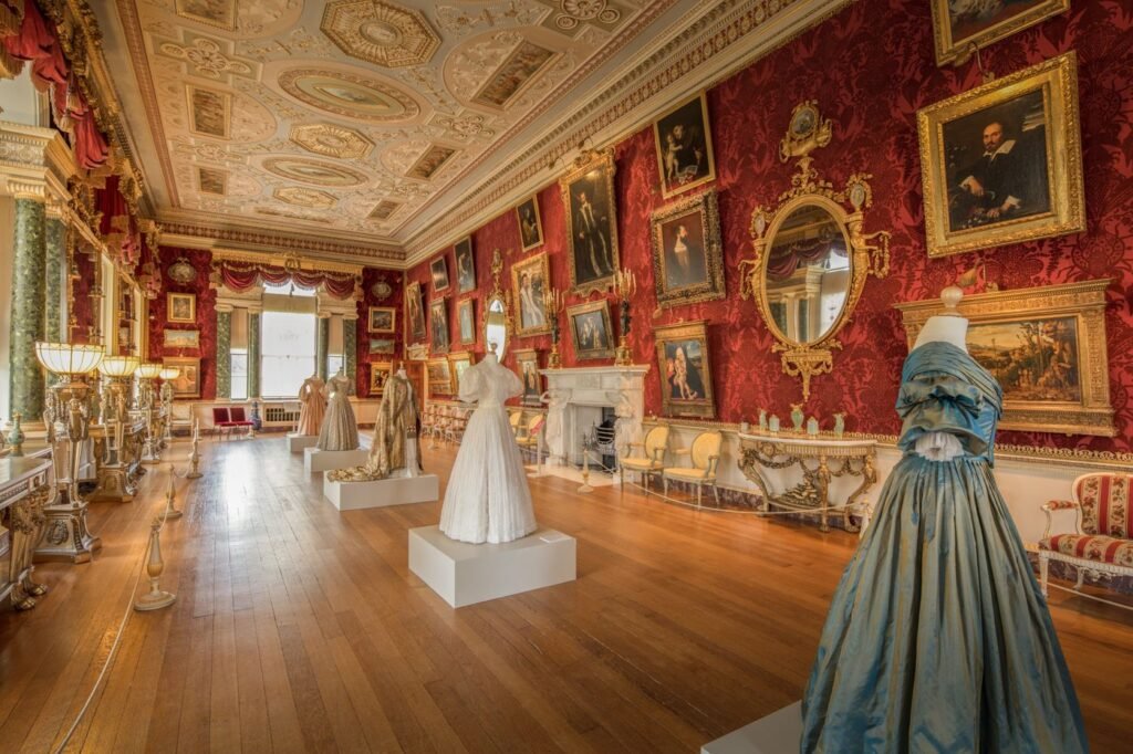 An ornate museum gallery hung with paintings