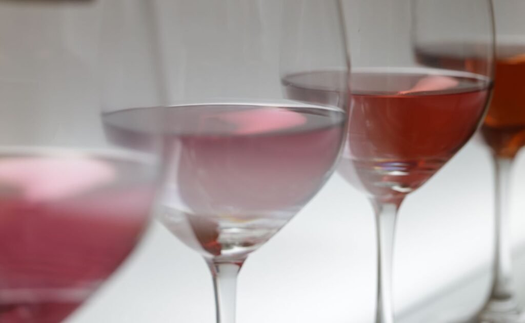 Two pale drinks in stemmed glasses