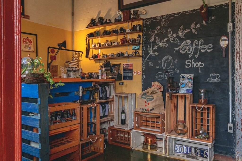 A small coffee shop interior with a chalkboard menu
