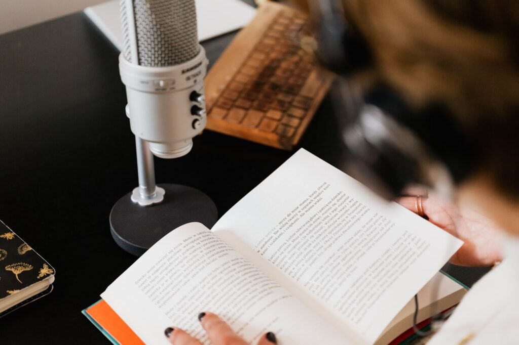 An open book beside a microphone