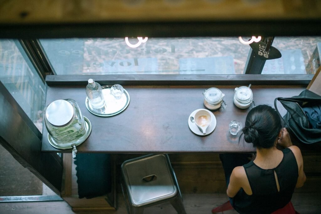 Cups on a cafe window counter seen from above