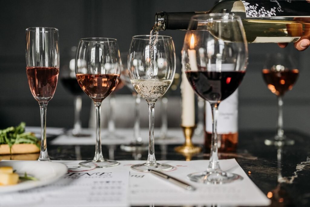 Red wine poured into tasting glasses
