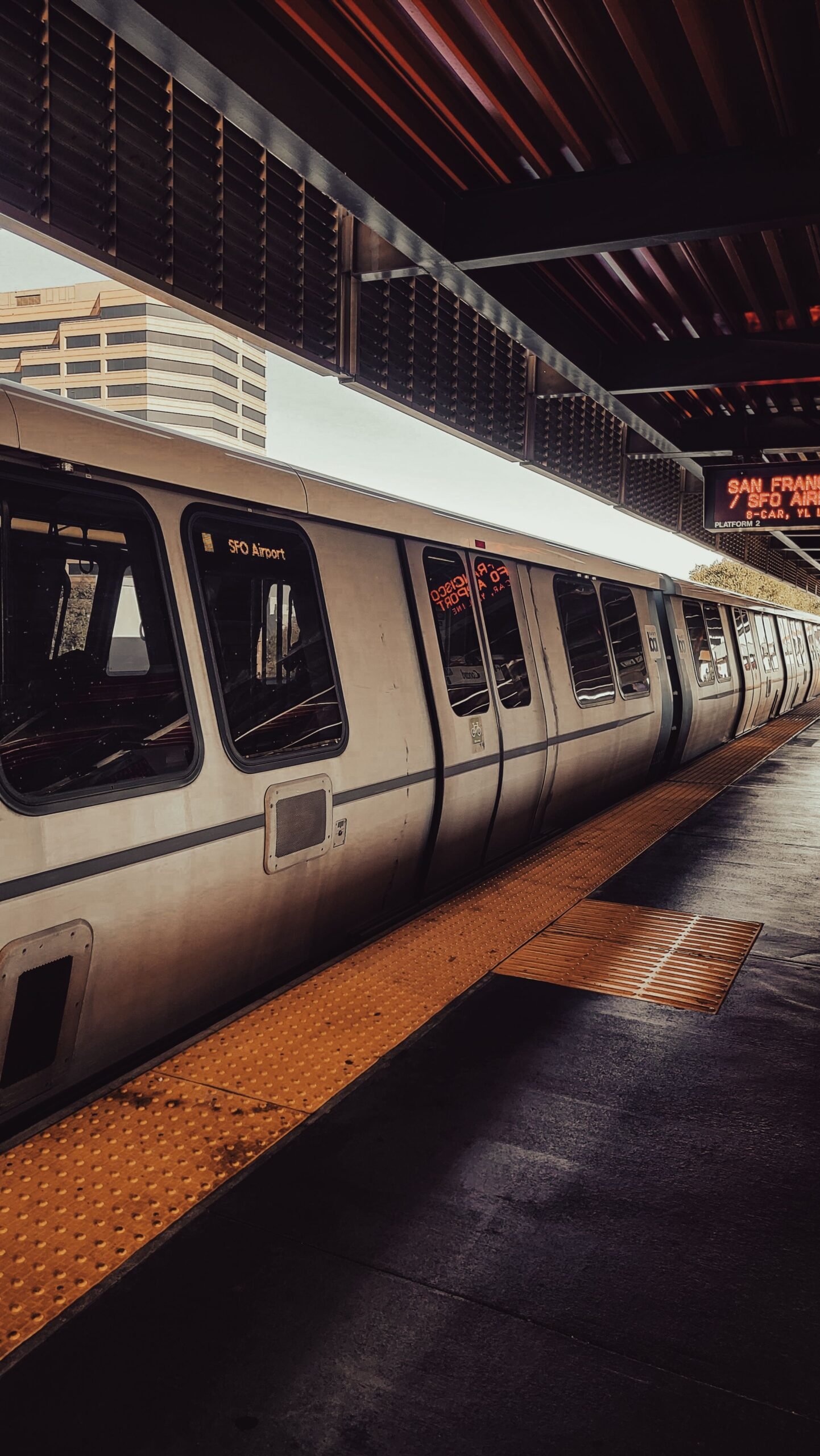 A BART train at a San Francisco station platform, near Glen Park