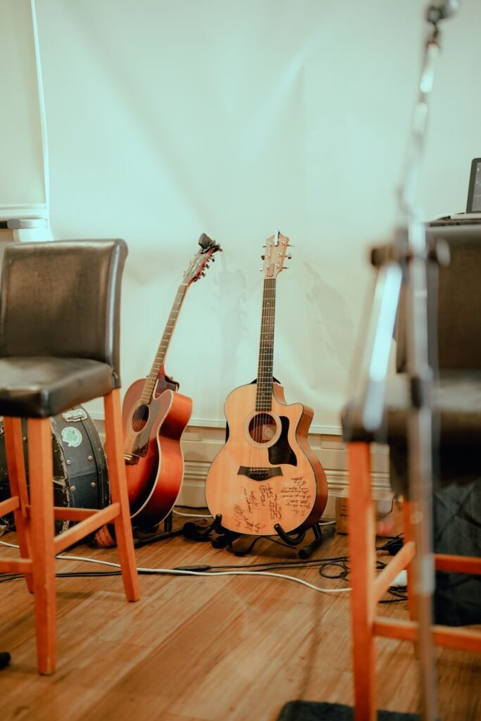A musician playing acoustic guitar outdoors