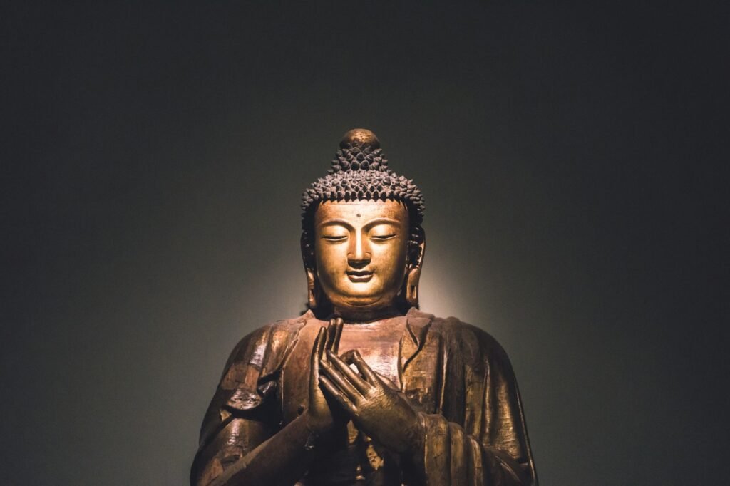 Gilded Buddha sculpture in soft light