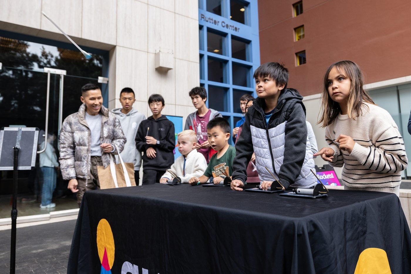 Kids launching paper and straw rockets at the Bay Area Science Festival 2025
