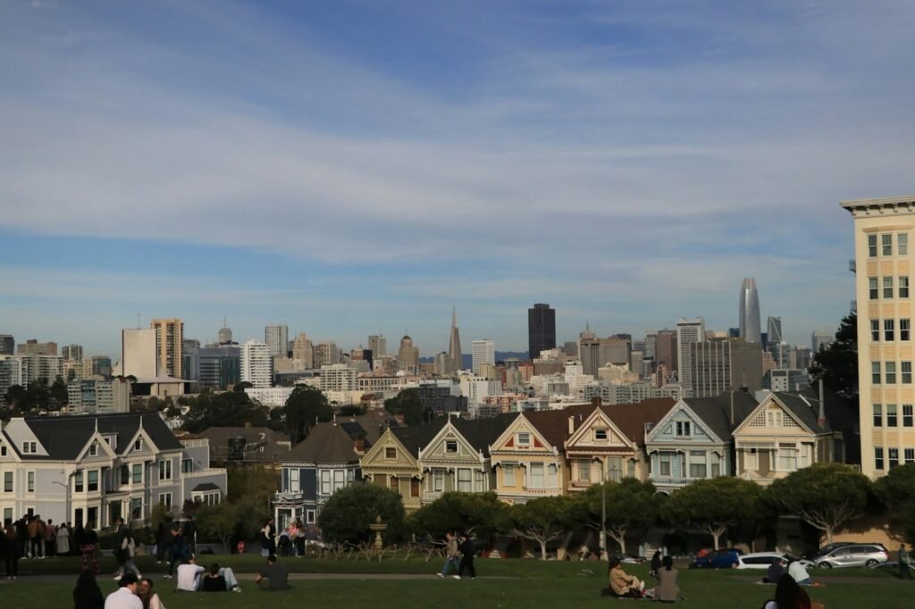 The Painted Ladies Victorian houses at Alamo Square with the San Francisco skyline behind.