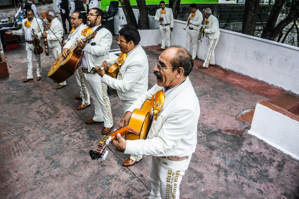 Mariachi musicians playing instruments on a stage