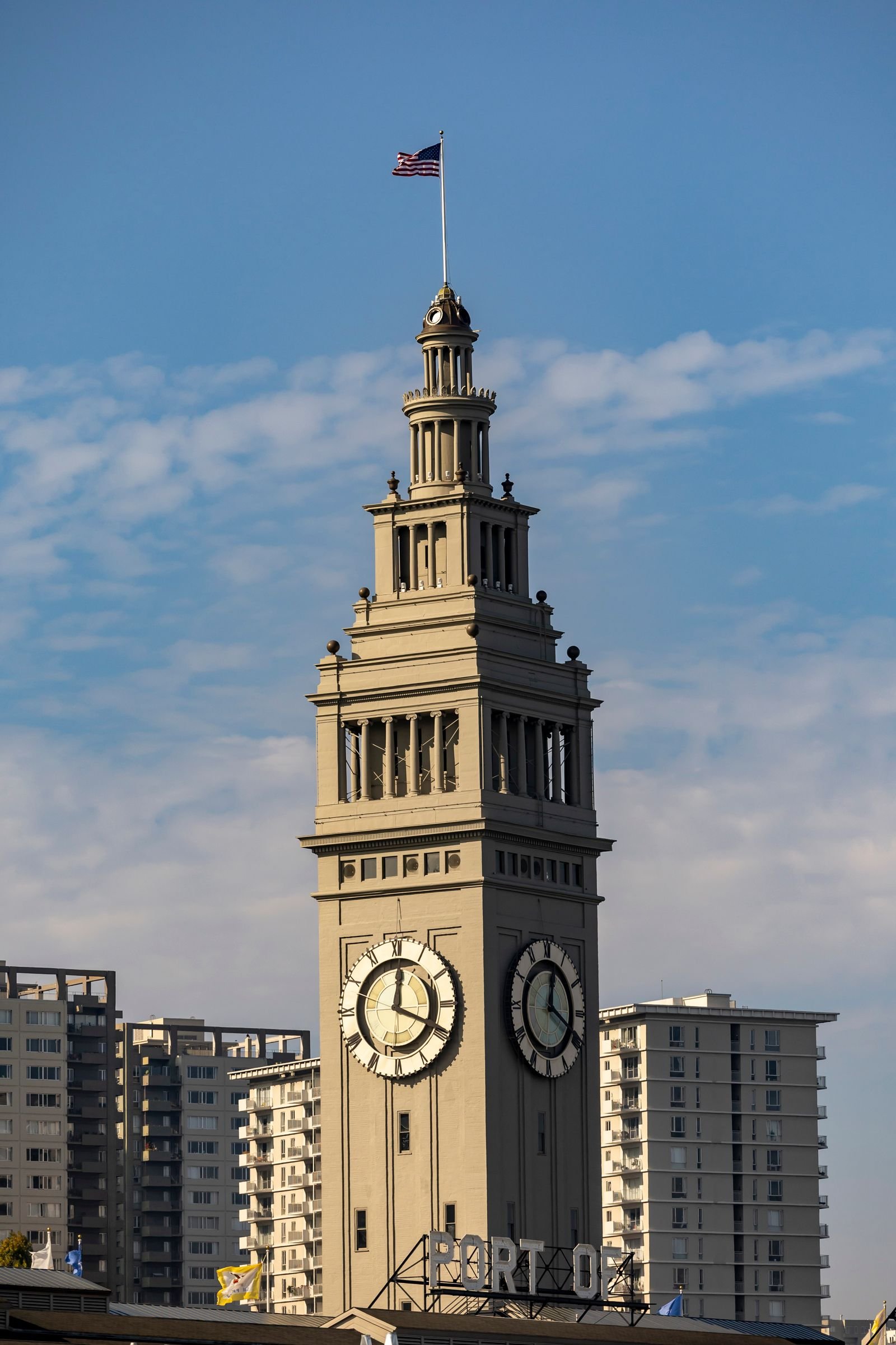 The Ferry Building clock tower against a blue sky.