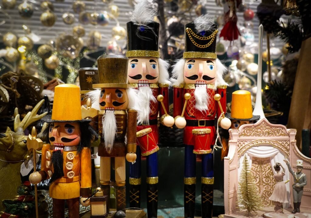 Wooden nutcracker figures among Christmas decorations.