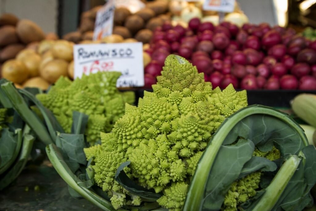Romanesco and root vegetables on a farmers' market stall