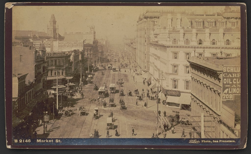 Market Street in San Francisco with horse-drawn carriages and cable cars, between 1885 and 1900