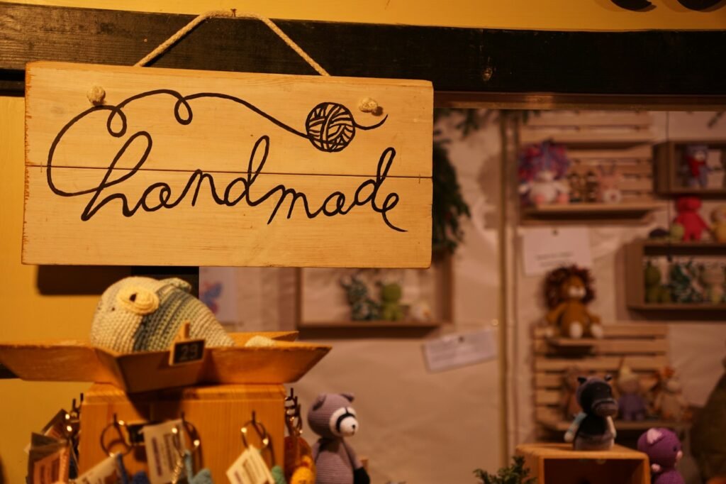 Wooden "handmade" sign at a craft stall