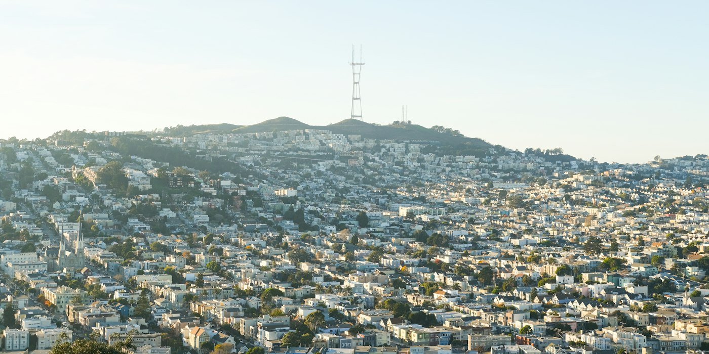 San Francisco houses and Sutro Tower seen from a hilltop