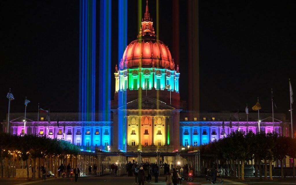 San Francisco City Hall lit in rainbow colors at night