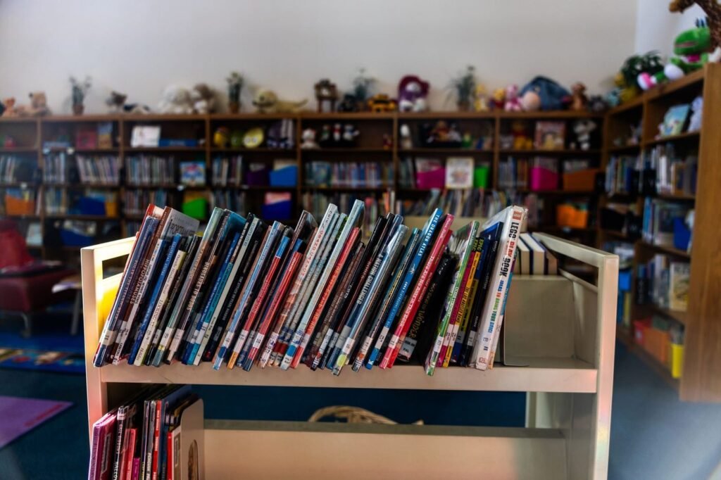 Library children's area with a cart of picture books
