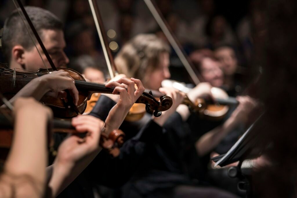 String players performing in a dimly lit hall