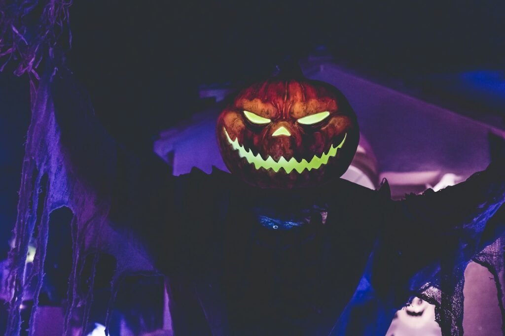 Glowing carved jack-o'-lantern at night